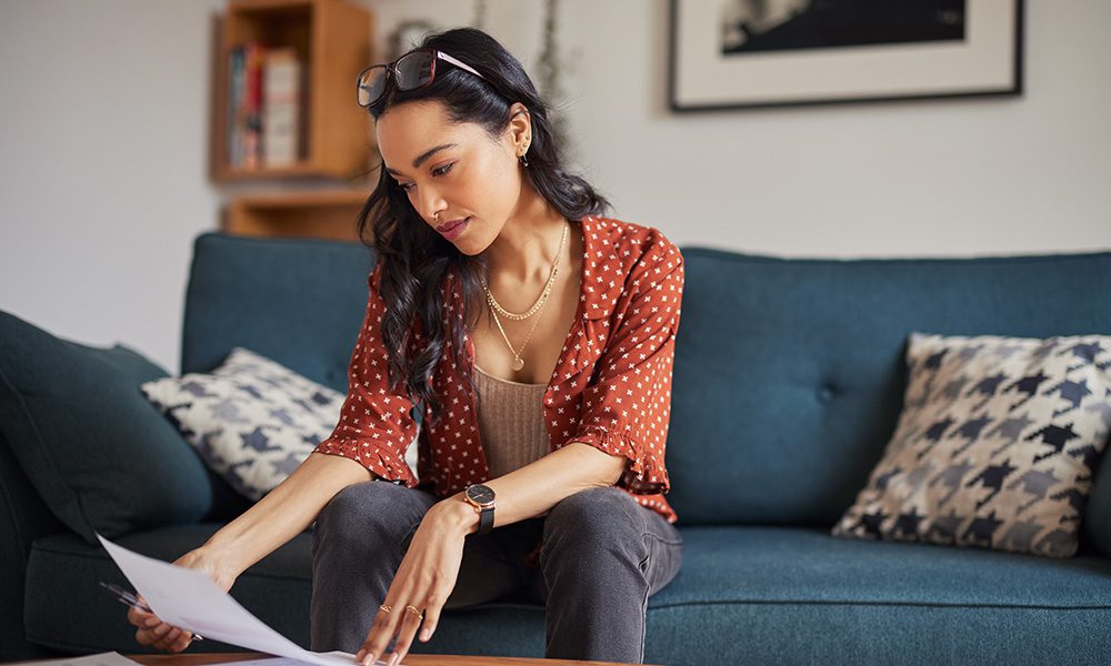 Why Did My Premium Go Up - Women Reading Documents at Home